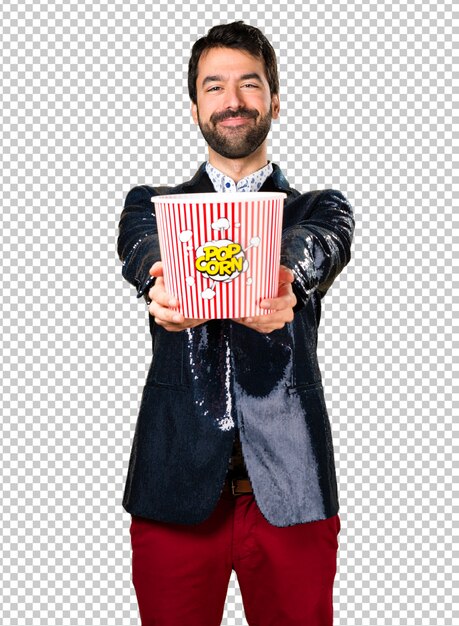 Man with jacket eating popcorns