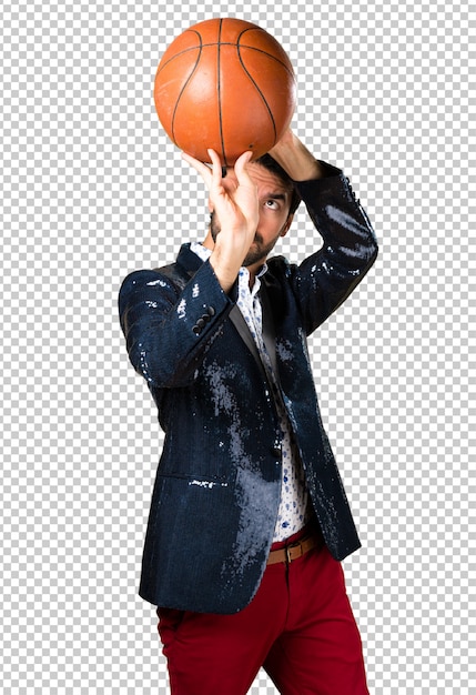 Man with jacket holding a basket ball