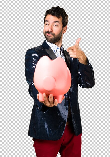 Man with jacket holding a piggybank