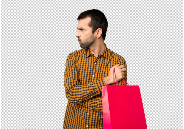 Man with shopping bags feeling upset