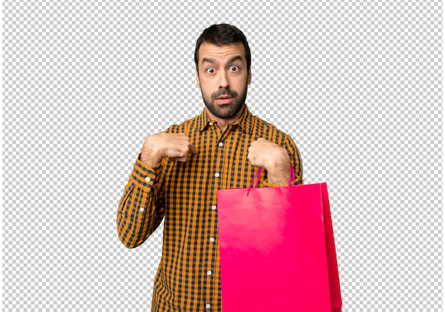 Man with shopping bags with surprise facial expression