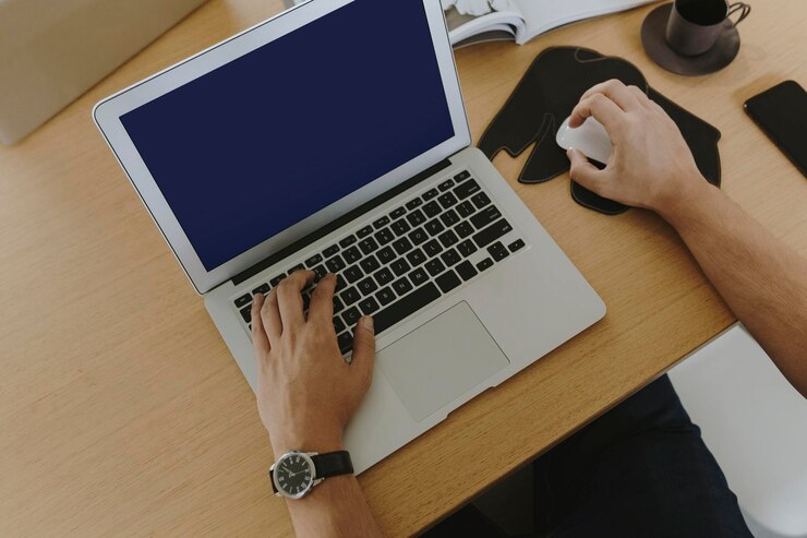 PSD man working on a laptop