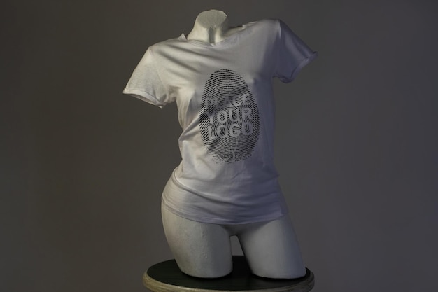 A mannequin with a white shirt that says place your logo on it.