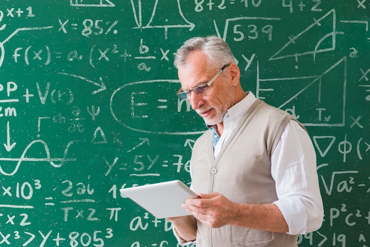 PSD math teacher holding white tablet