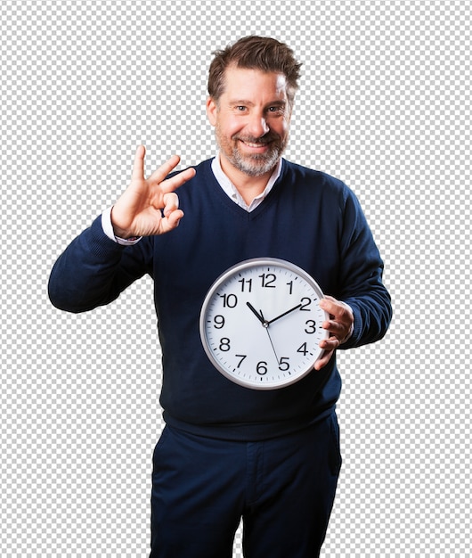 Mature man holding a clock