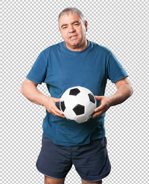 サッカーボールで遊ぶ中年の男性
