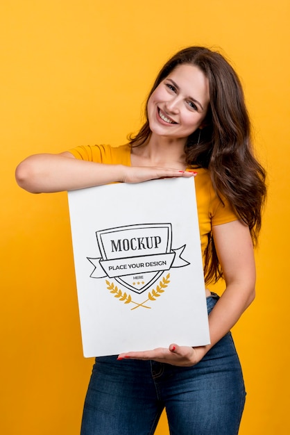 Medium shot smiley girl holding board