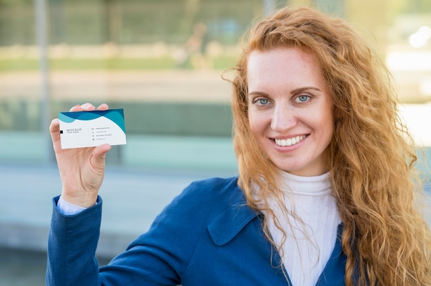 PSD medium shot woman holding business card