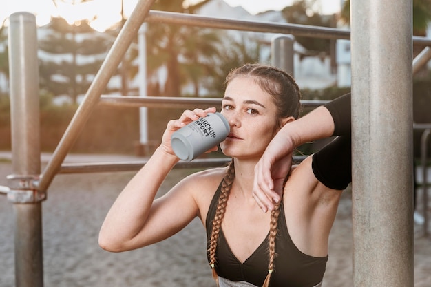 PSD medium shot woman holding can