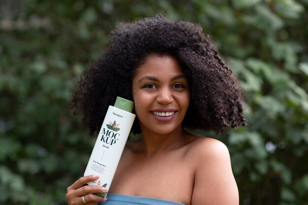 Medium shot woman using curly hair shampoo