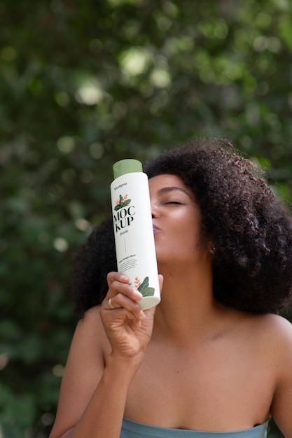 PSD medium shot woman using curly hair shampoo