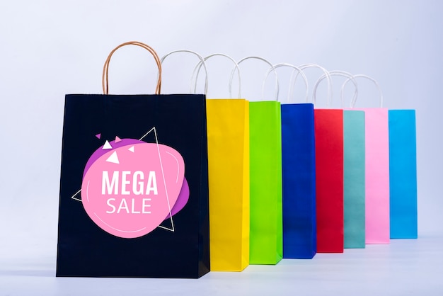 Mega sale banner with colorful paper bags