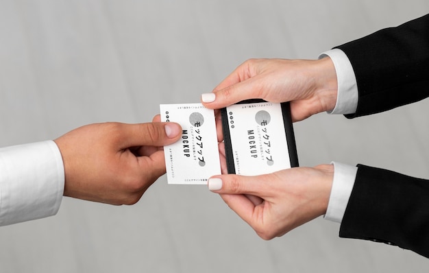 Men holding business cards mock-up