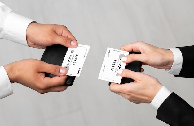 Men holding business cards mock-up