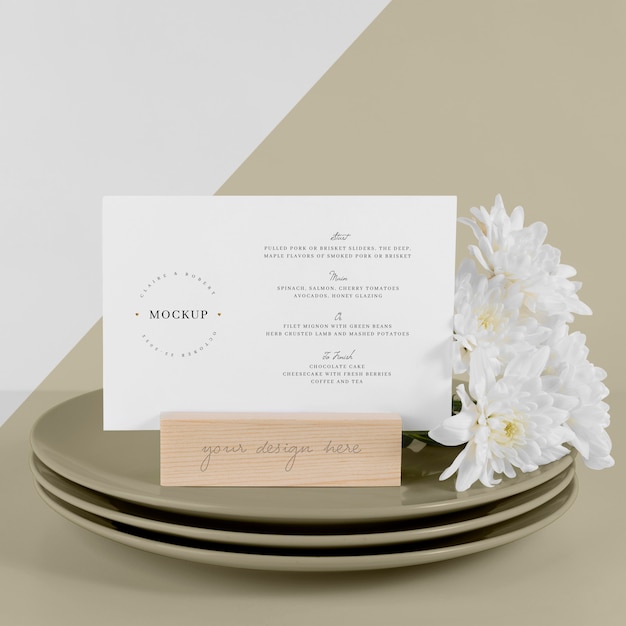 Menu mock-up with dishes and white flowers