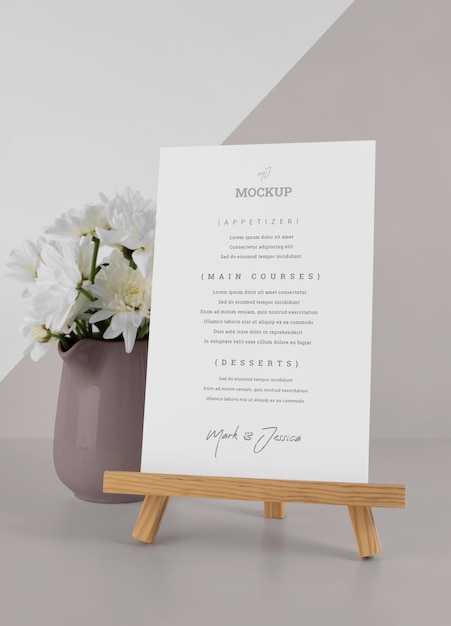 Menu mock-up with wooden stand and flower vase