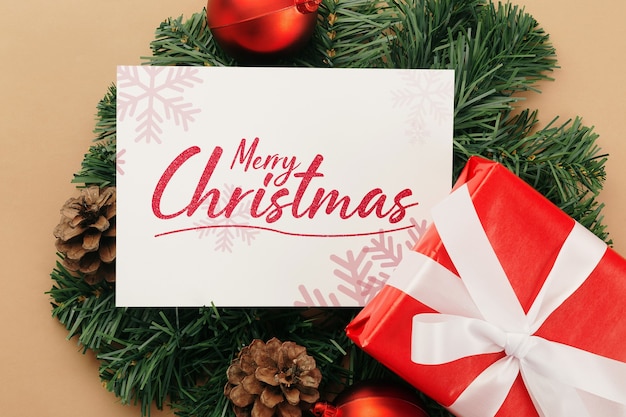 Merry Christmas greeting card mockup with Christmas gifts decorations