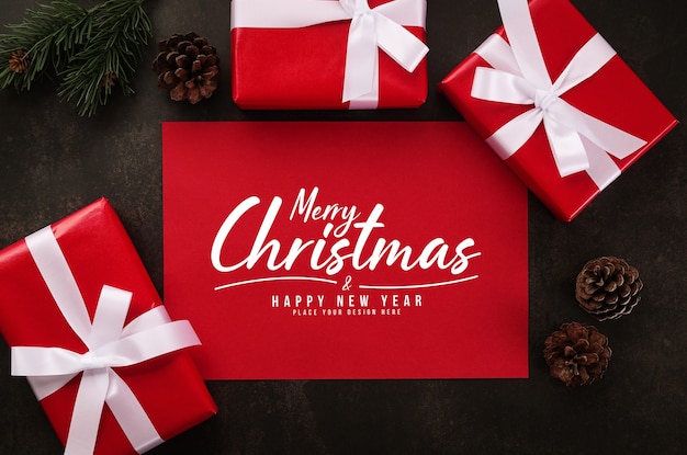 Merry Christmas greeting card mockup with Christmas gifts decorations