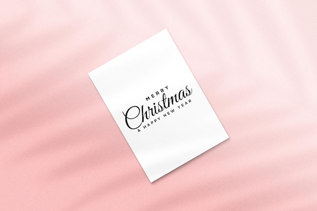 Merry christmas greeting card mockup with palm leaves shadow