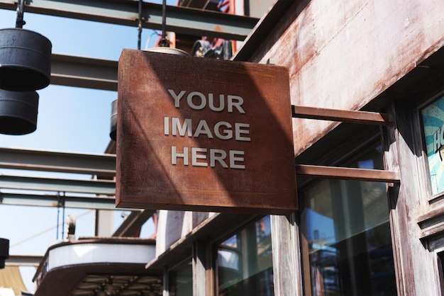 A metal sign that says your image here