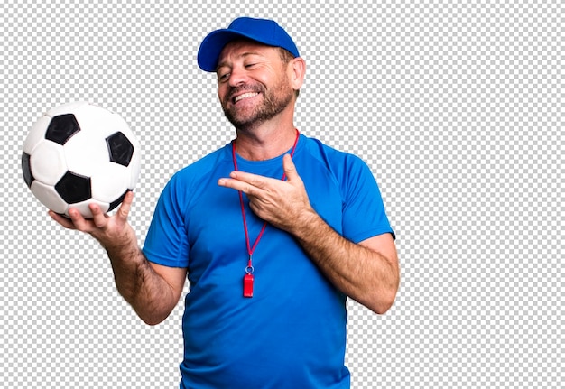 Middelbare leeftijd man sport coach concept met een voetbal