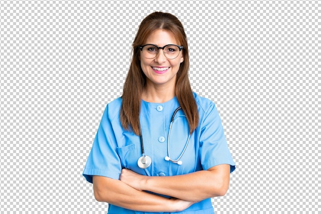 PSD middle age nurse woman over isolated background keeping the arms crossed in frontal position