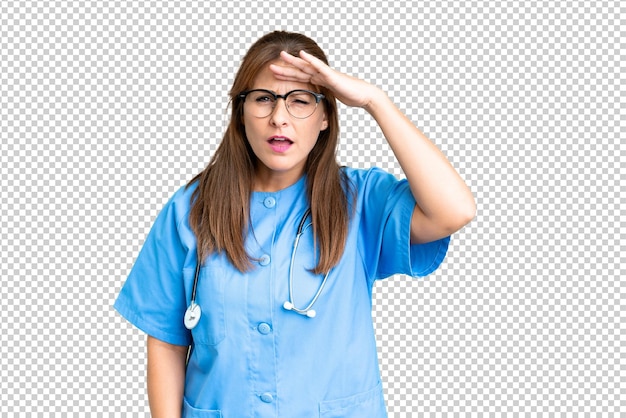 PSD middle age nurse woman over isolated background looking far away with hand to look something