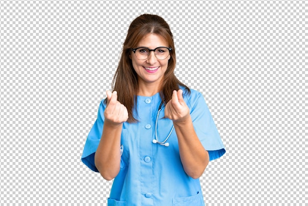 PSD middle age nurse woman over isolated background making money gesture