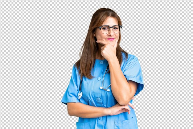 Middle age nurse woman over isolated background smiling