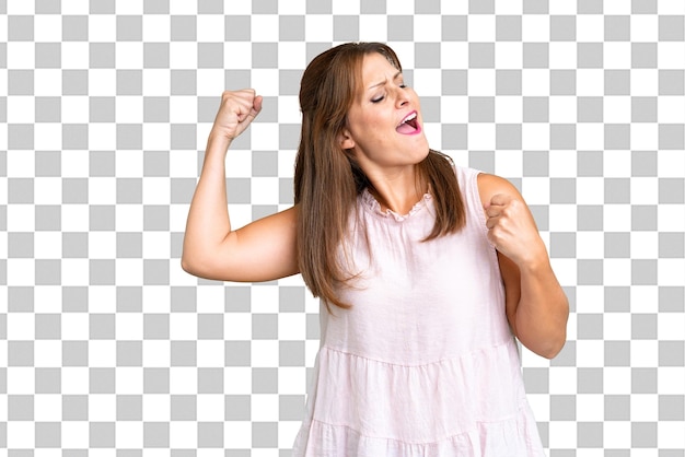 middle age woman over isolated background celebrating a victory