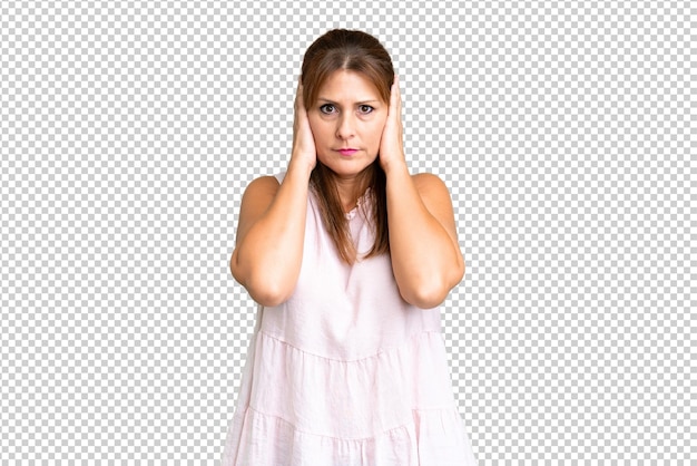 PSD middle age woman over isolated background frustrated and covering ears