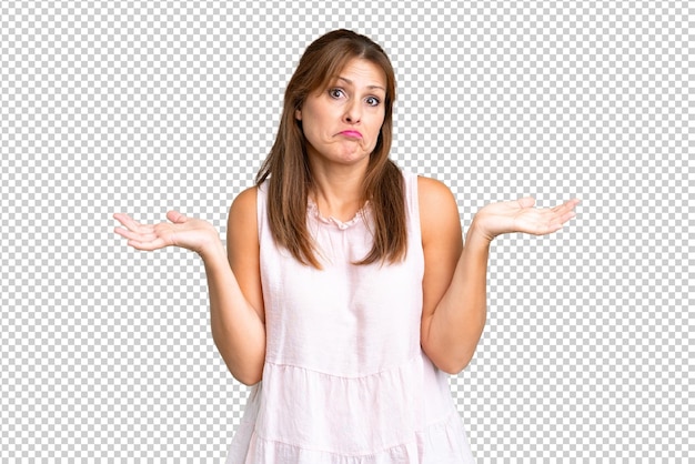 PSD middle age woman over isolated background having doubts while raising hands