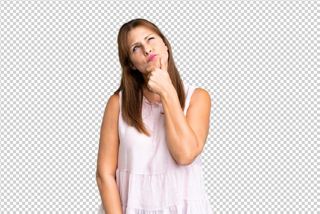 PSD middle age woman over isolated background having doubts