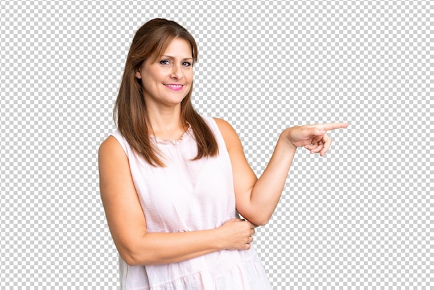 PSD middle age woman over isolated background pointing finger to the side