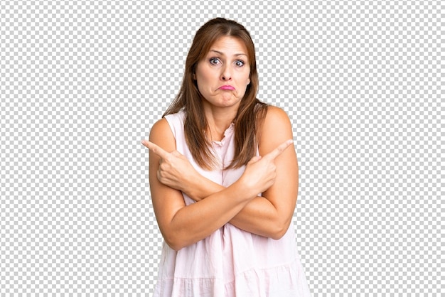 PSD middle age woman over isolated background pointing to the laterals having doubts