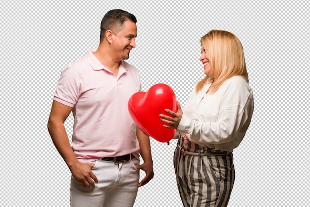 Middle aged latin couple celebrating valentines day