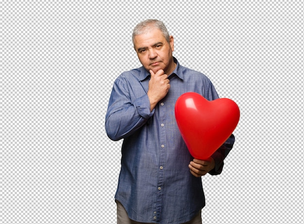 Middle aged man celebrating valentines day thinking about an idea