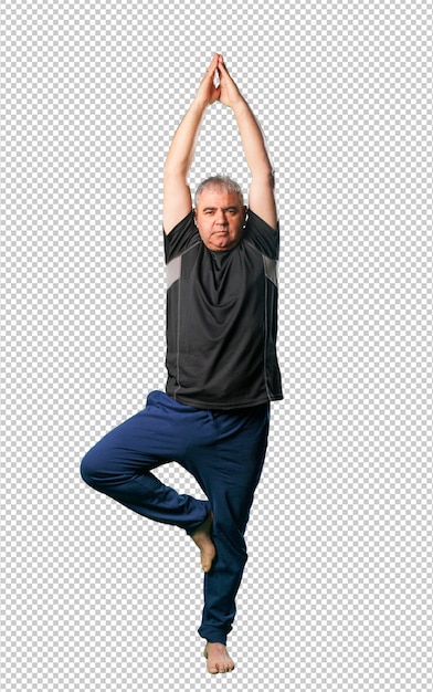 PSD middle aged man doing yoga exercises full body