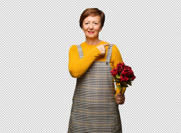 PSD middle aged woman celebrating valentines day smiling and pointing to the side