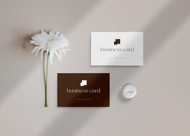 Minimal business card mockup with flower and candle background