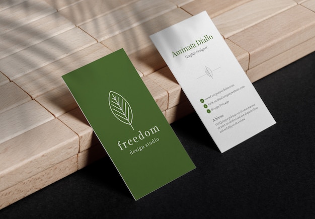 Minimal business cards mockup sitting on wooden block