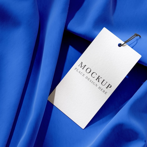 Minimal Clothing Tag Mockup on Blue Fabric