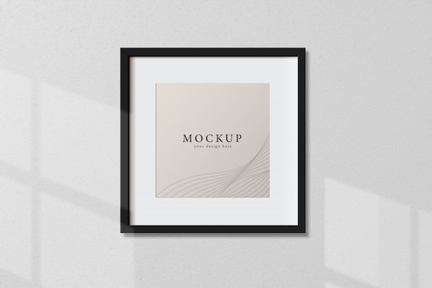 PSD minimal empty square black frame picture mock up hanging on white wall background with window light and shadow. isolate vector illustration.