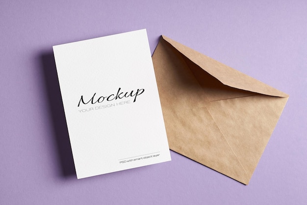 Minimal stationary card mockup with envelope on lavender color paper background