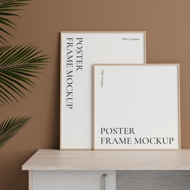 Minimalist front view woodenphoto or poster frame mockup leaning against wall on table with plant 3d rendering