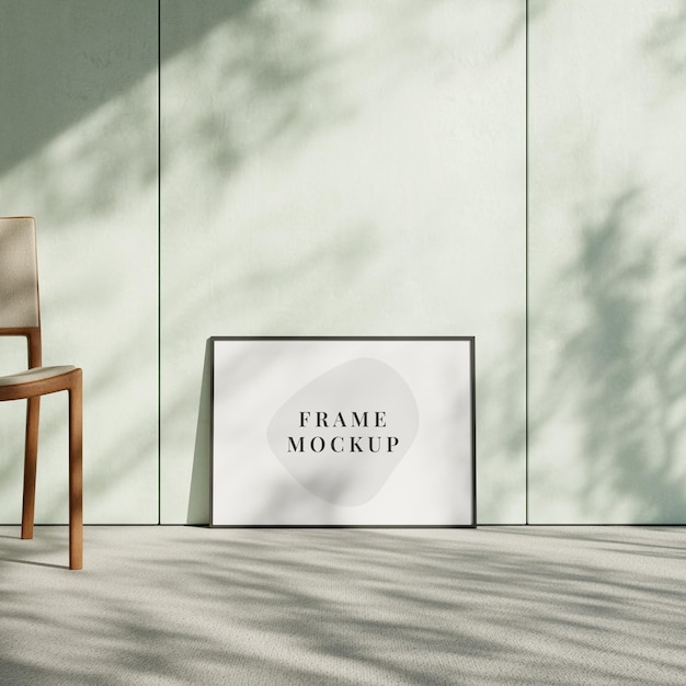 Minimalist poster frame mockup leaning against the wall in interiors with shadow