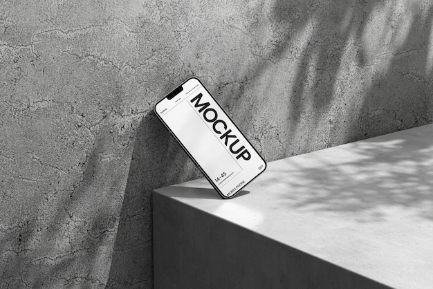 Mockup psd mobile con scena d'ombra in cemento