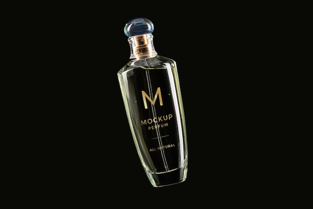 Mock-up of clear bottle of perfume on black background