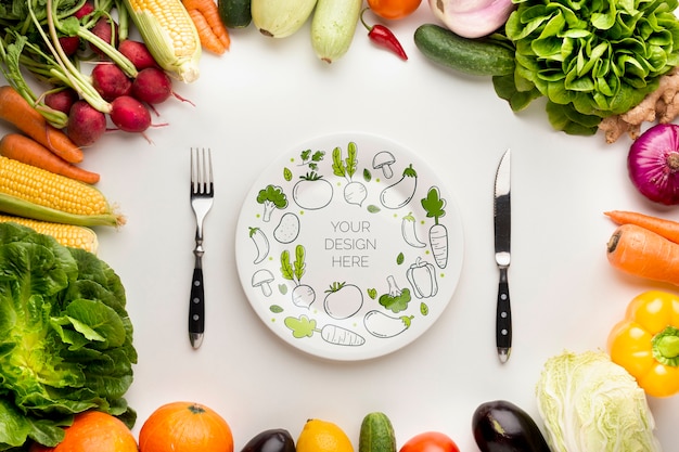 PSD mock-up and cutlery with frame made from delicious fresh veggies