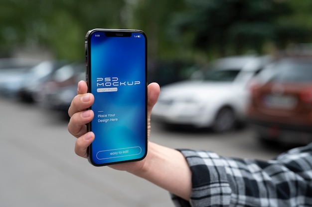 PSD mock-up design on smartphone touchscreen held by person